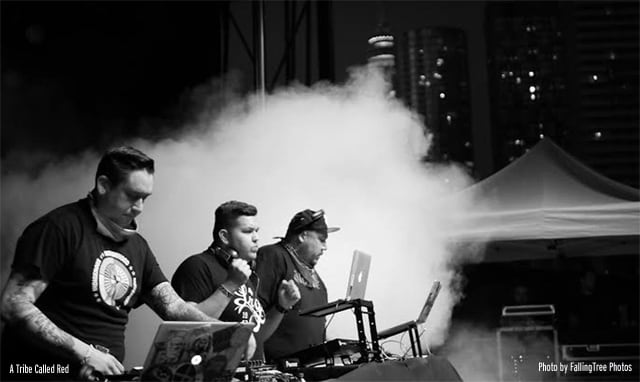 A Tribe Called Red performing on stage